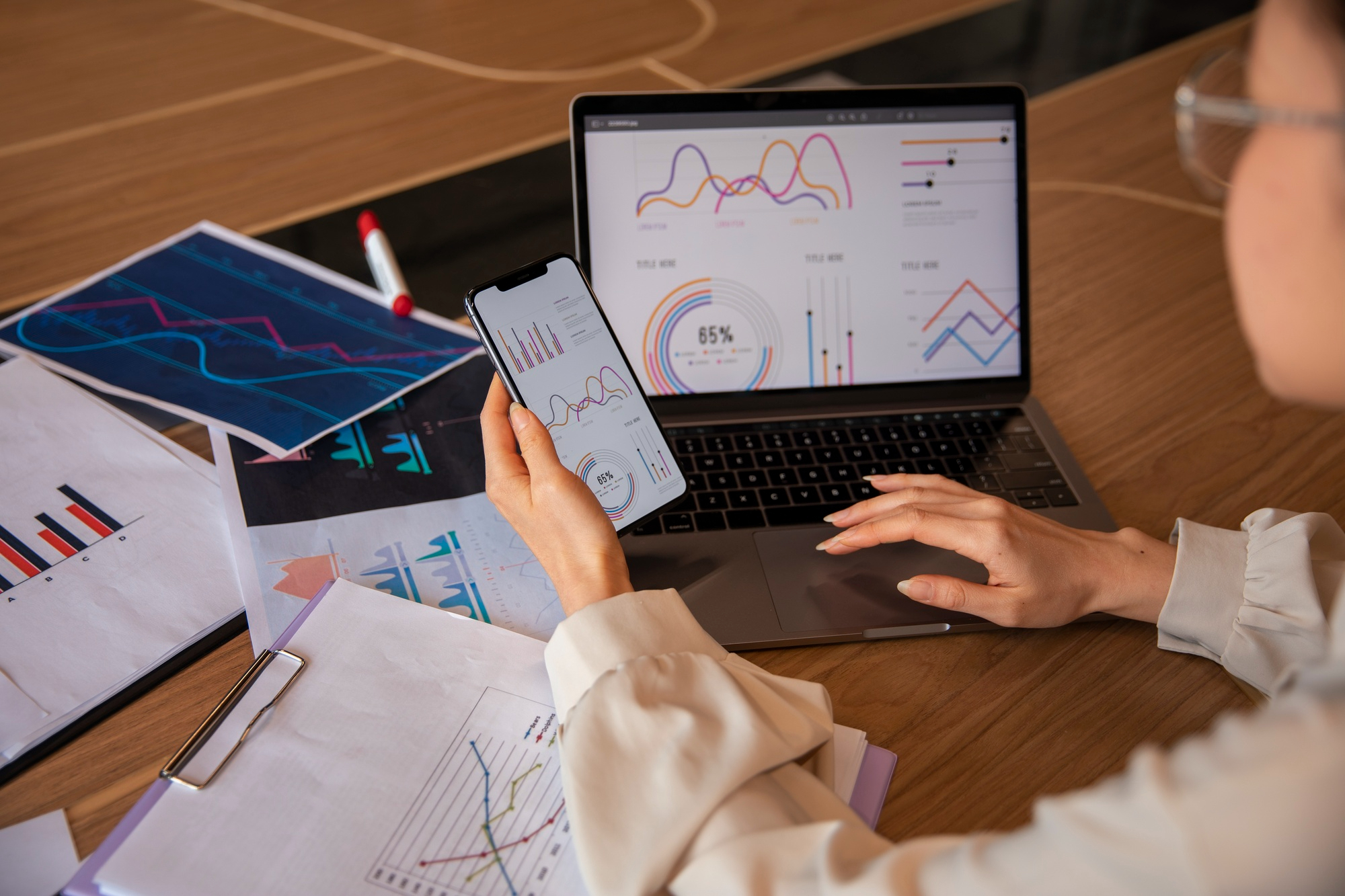 Office worker using finance graphs